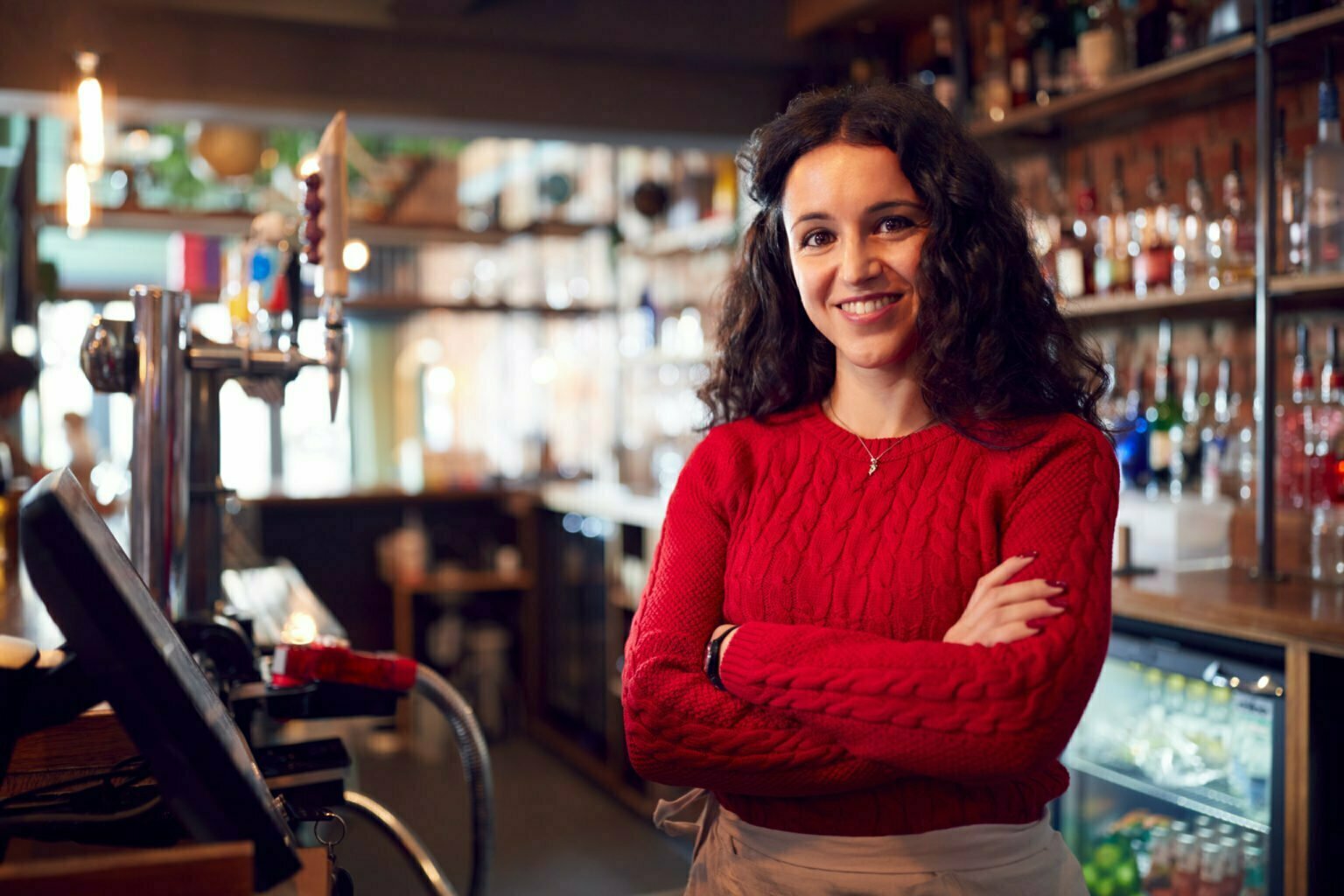 a person standing in a bar